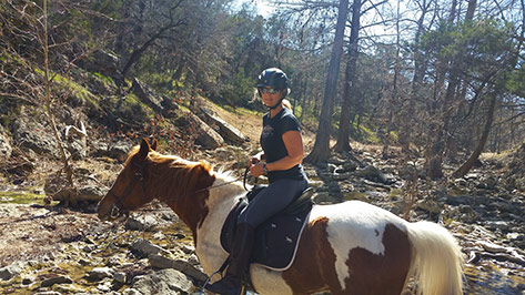 rider in the creek at Reimers Ranch