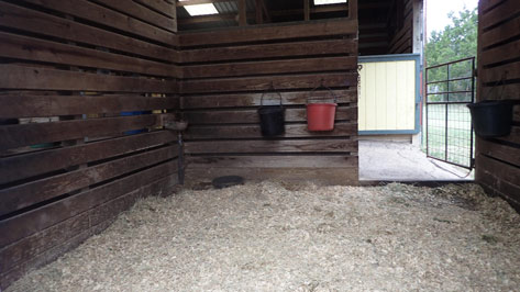 interior of a stall, wood lined