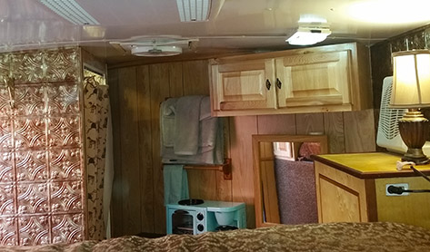 horse trailer interior showing cooking shelf, shower and sink